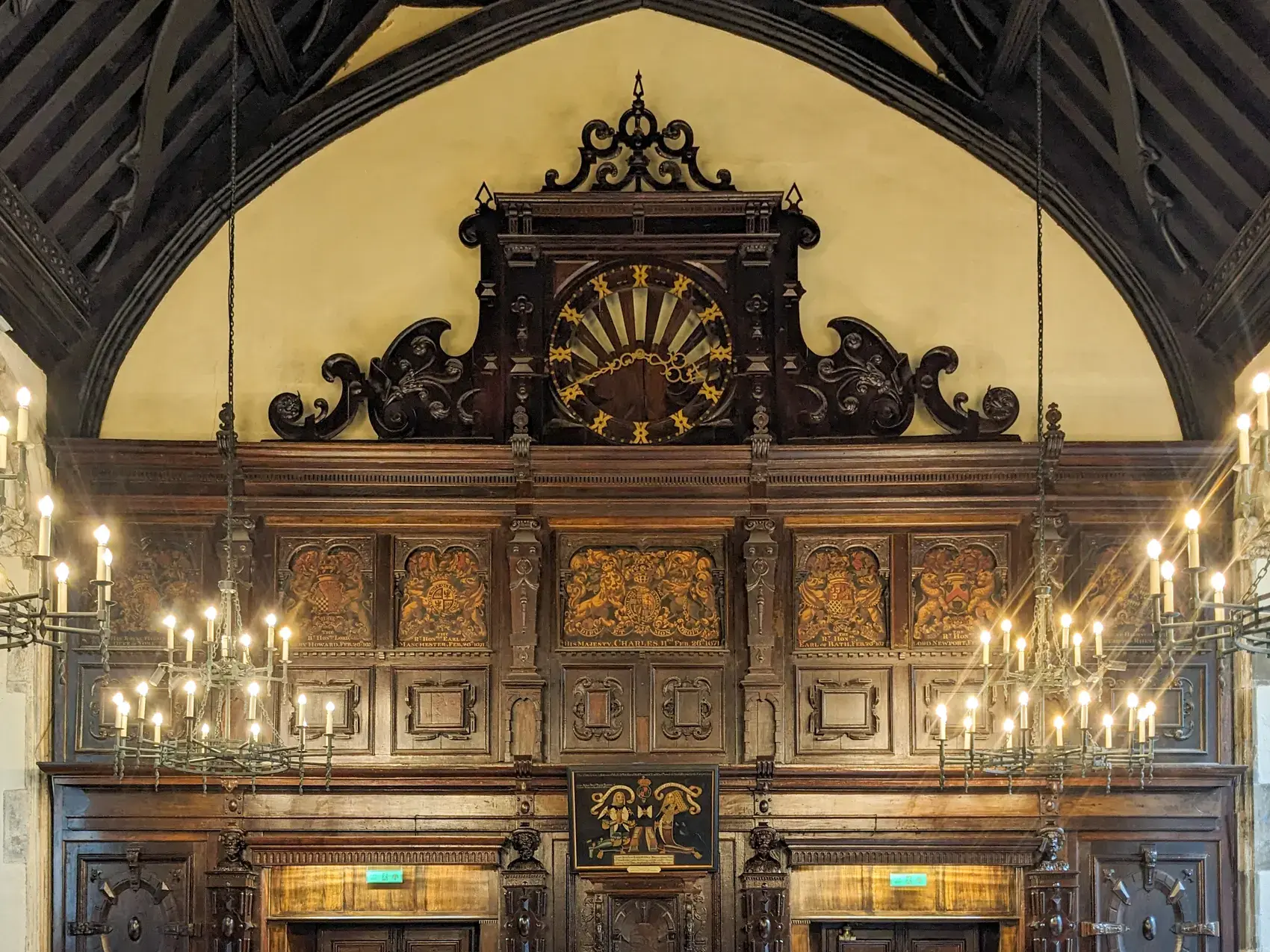 Carved screen and chandeliers in the Old Hall of Lincoln's Inn